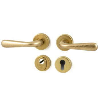 Veiligheidsset Monza met deurkrukken Silvia messing getrommeld